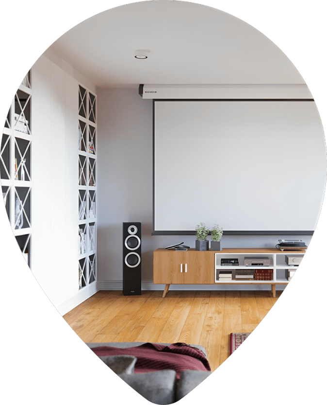 A room with a large screen and speakers.